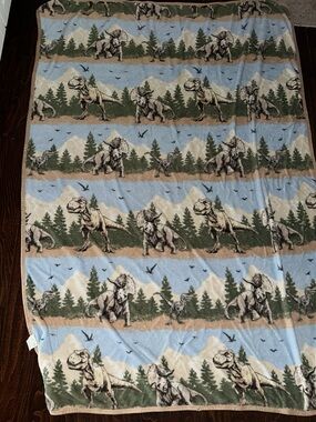 Jurassic world fleece blanket all over dinosaur print blue and green